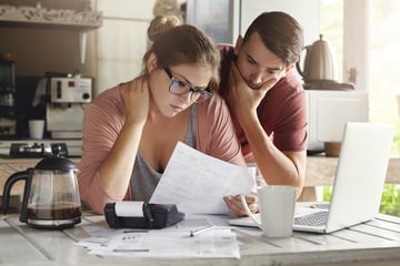couple looking at bills