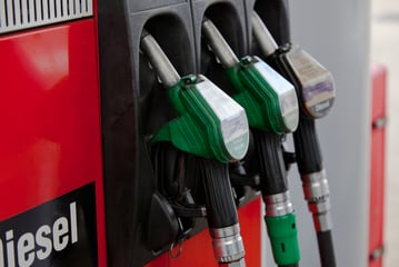 Close up of a gas service station and three types of gas handles.
