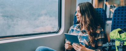 woman travelling and looking out the window